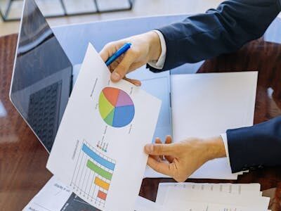 pexels-photo-5816283-5816283 Business professionals analyzing financial charts and graphs during a meeting.